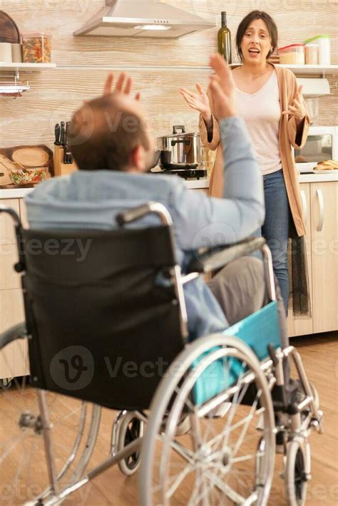 Wife screaming in kitchen to her disabled man in wheelchair while ... 