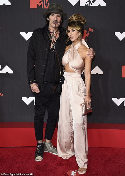 tommy lees wife brittany furlan flashes  chest   drummer