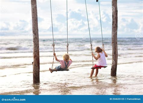 child  swing kid swinging  beach stock image image  outdoor