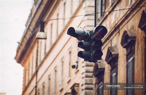 Traffic light hanging at street scene in Rome, Italy — italian, walk - Stock Photo | #171149634